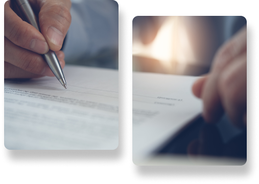 Mano de una persona con un bolígrafo de metal, firmando un contrato o formulario importante sobre papel blanco.